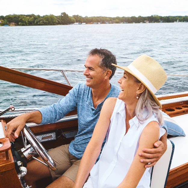 Man & Woman Ocean Adventure Together in Boat