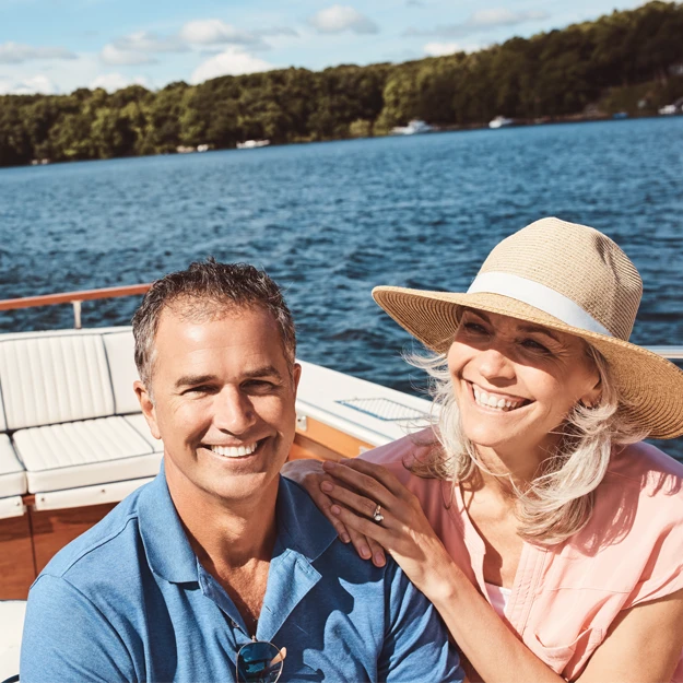Happy Couple Riding Boat
